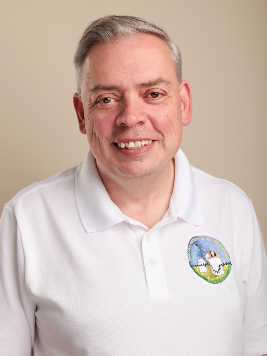 Michael Person in a white Wallace Astrophysical Observatory polo shirt